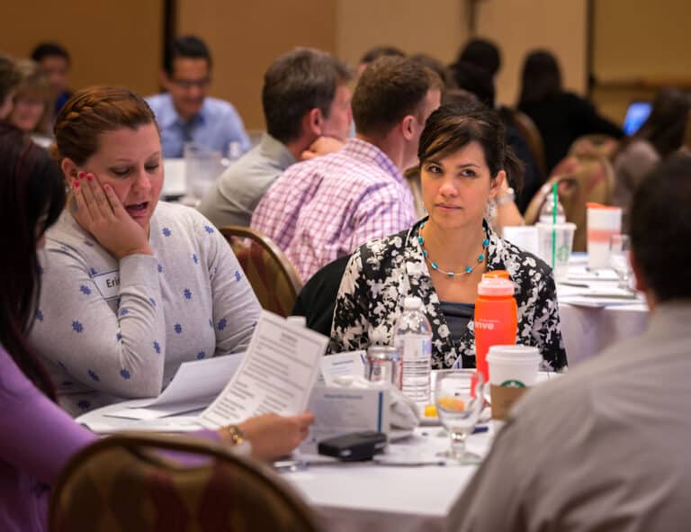 Team discussing DISC communication styles in a workshop